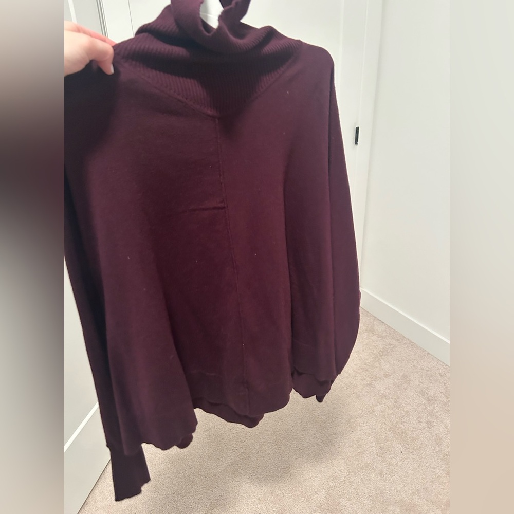 Barely work. Excellent condition. Plum color flowy turtleneck sweater